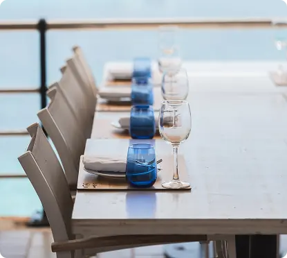 Tables laid with white linen and glasses