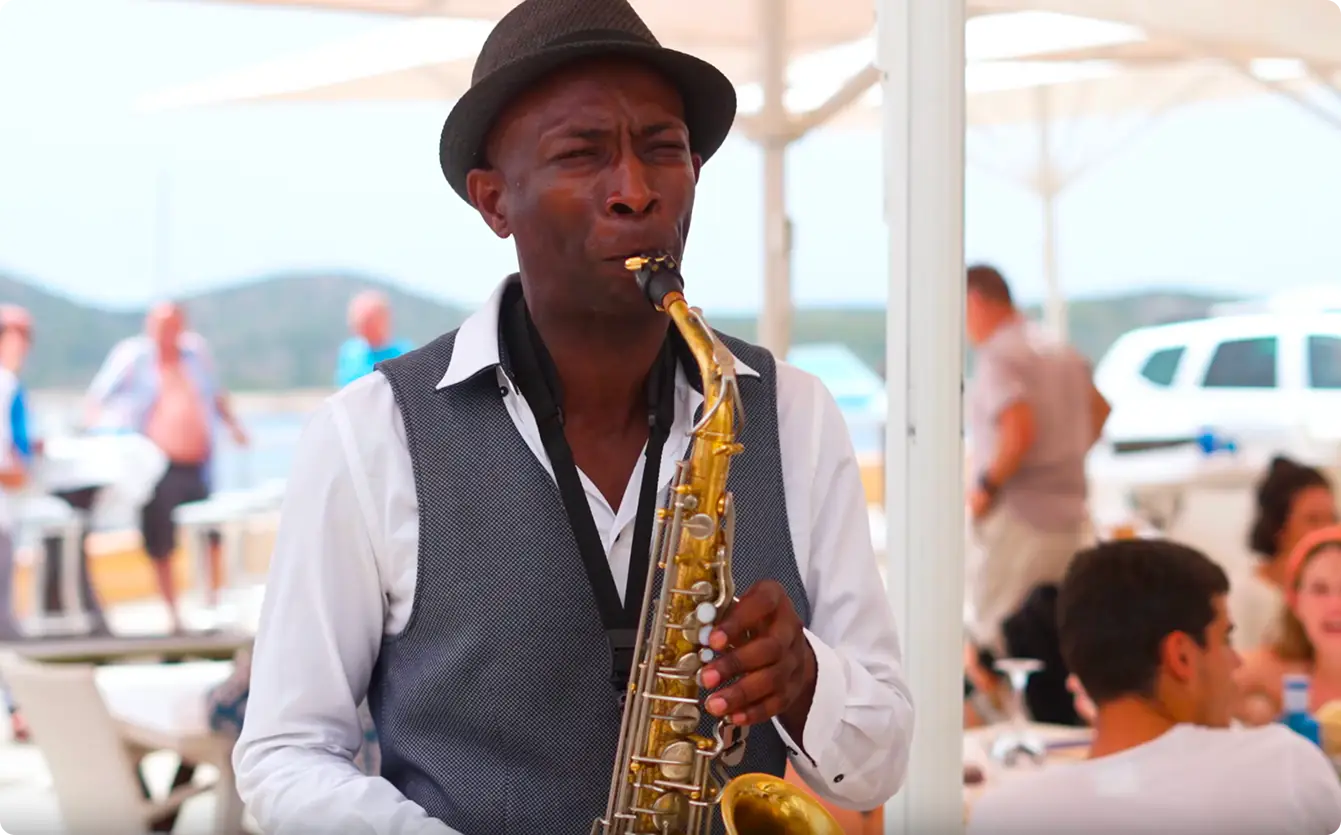 Saxophonist playing on the terrace during an event